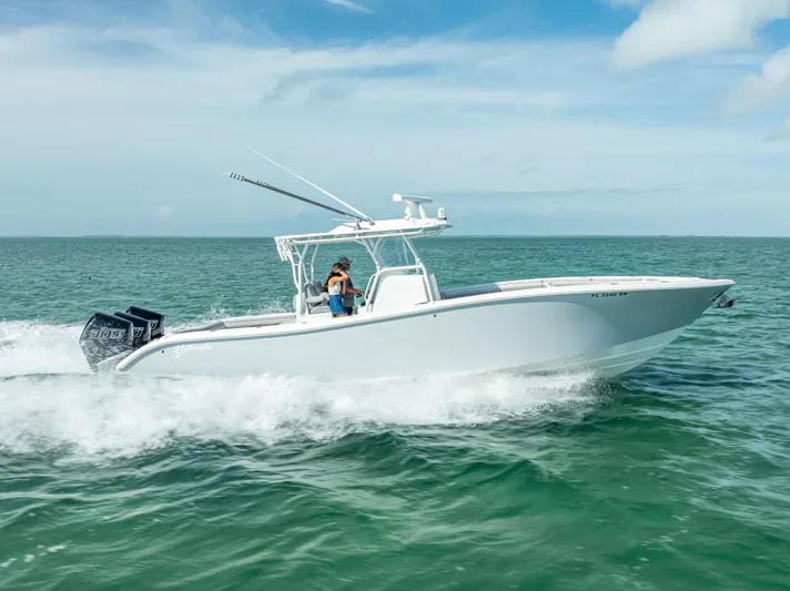  Yacht Photos Pics 2020 Yellowfin 34 boat cruising on open water under clear skies.