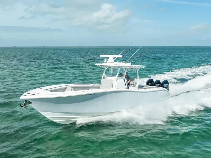  Yacht Photos Pics 2020 Yellowfin 34 boat cruising on open water, clear skies above.