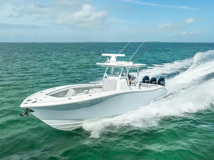  Yacht Photos Pics 2020 Yellowfin 34 boat cruising on open water, showcasing sleek design and powerful engines.