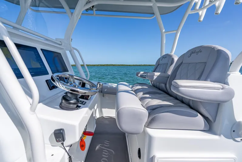  Yacht Photos Pics 2020 Yellowfin 34 boat interior with sleek helm and comfortable seating.