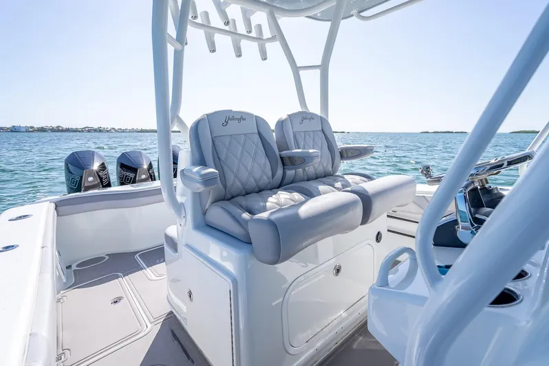  Yacht Photos Pics 2020 Yellowfin 34 boat interior with luxury seating and dual engines on the water.