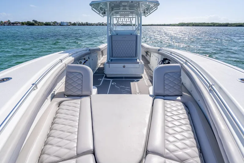  Yacht Photos Pics 2020 Yellowfin 34 boat with luxurious seating on open water.
