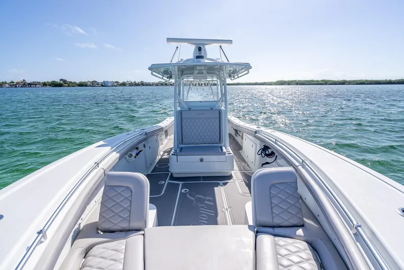  Yacht Photos Pics 2020 Yellowfin 34 boat on open water, featuring spacious seating and sleek design.