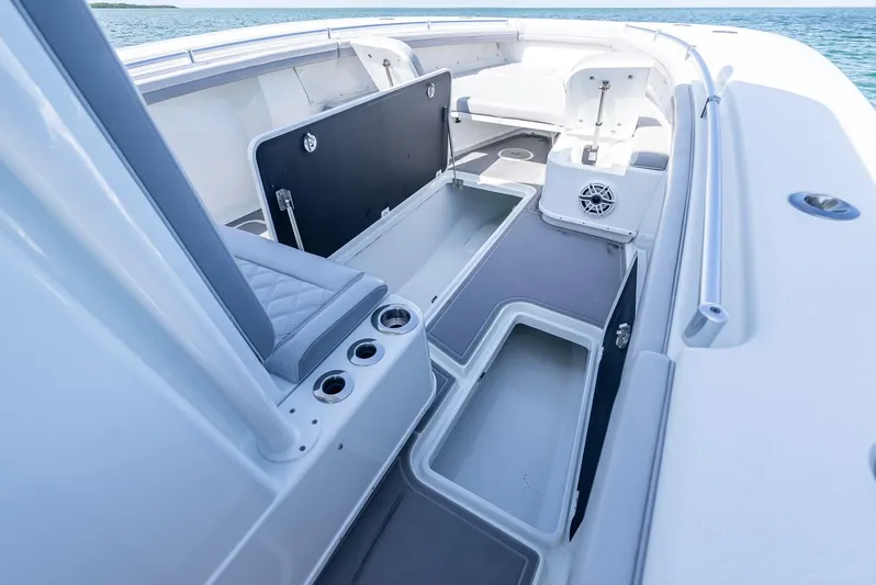 Yacht Photos Pics 2020 Yellowfin 34 boat interior with open storage compartments and seating.