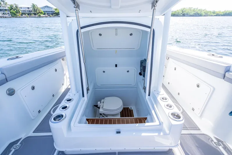  Yacht Photos Pics 2020 Yellowfin 34 boat interior with open hatch and marine toilet.