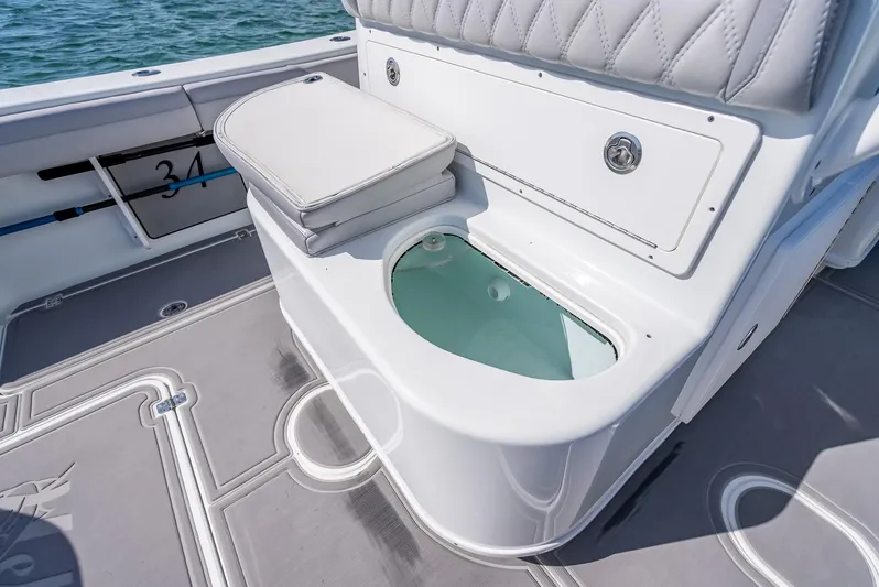  Yacht Photos Pics 2020 Yellowfin 34 boat interior with cushioned seating and storage compartment.