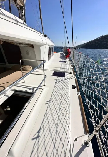  Yacht Photos Pics Lagoon 560 yacht deck, 2011 model, sailing on a sunny day with clear blue skies.