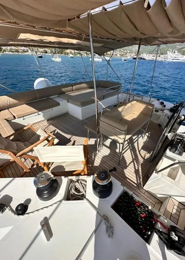  Yacht Photos Pics Luxurious 2011 Lagoon 560 yacht deck with seating, overlooking serene blue waters.