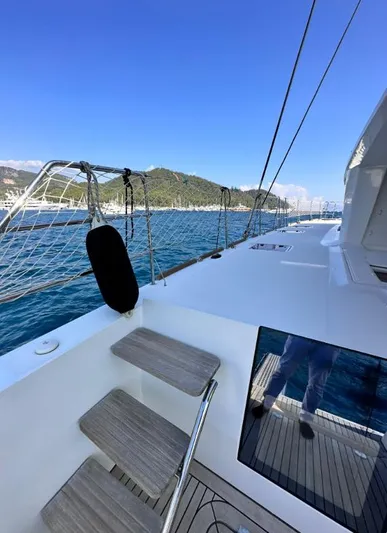  Yacht Photos Pics 2011 Lagoon 560 yacht deck with ocean view and clear blue sky.