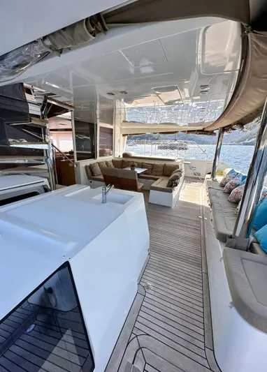  Yacht Photos Pics Spacious deck of 2011 Lagoon 560 yacht with seating and ocean view.