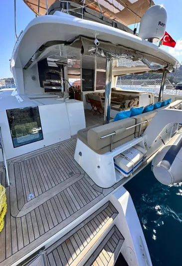  Yacht Photos Pics Luxurious 2011 Lagoon 560 yacht with spacious deck and seating area, featuring Turkish flag.