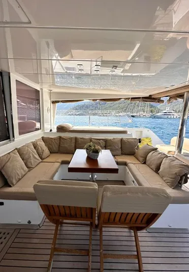  Yacht Photos Pics Luxurious Lagoon 560 yacht interior, 2011 model, featuring elegant seating and scenic ocean view.