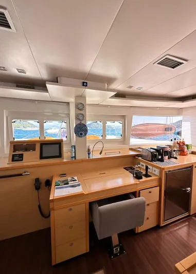  Yacht Photos Pics Interior of 2011 Lagoon 560 yacht with modern kitchen and navigation area.