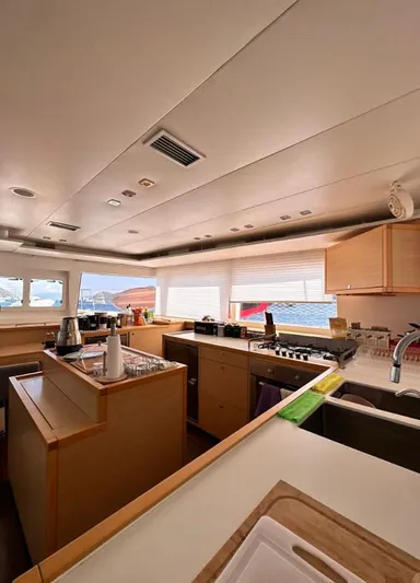  Yacht Photos Pics Interior of 2011 Lagoon 560 yacht kitchen with modern amenities and ocean view.