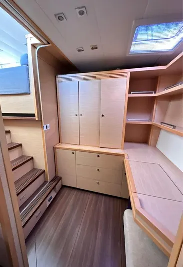  Yacht Photos Pics Interior of 2011 Lagoon 560 yacht with wooden cabinetry and built-in desk.