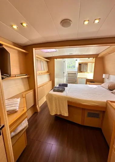  Yacht Photos Pics Luxurious interior of 2011 Lagoon 560 yacht with cozy bedroom and modern amenities.