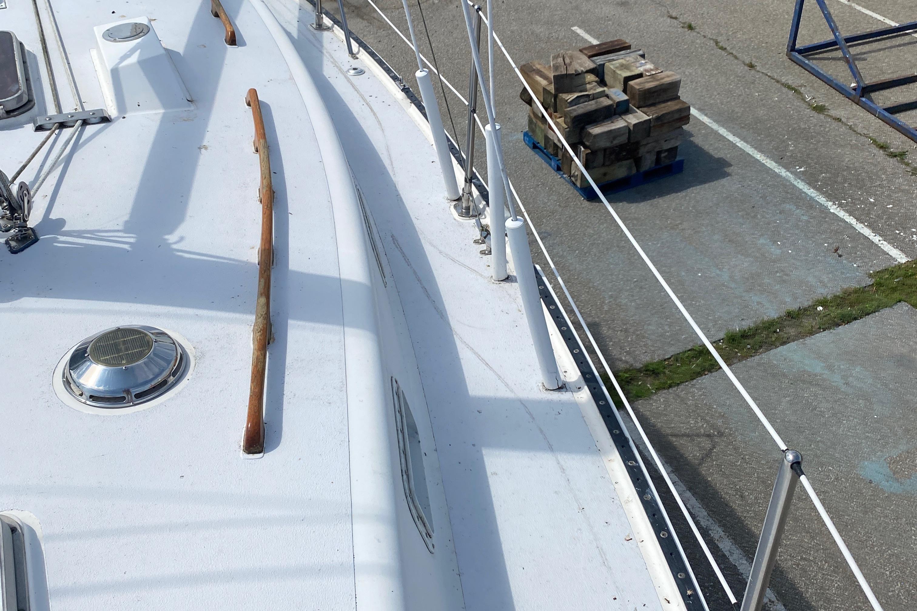 Deck view of 1985 Aloha 34 sailboat with dockside equipment.
