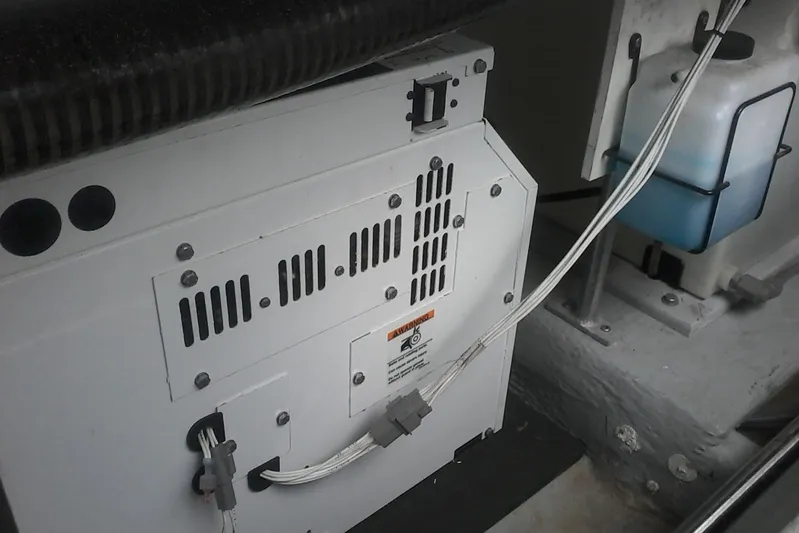 Lusea Yacht Photos Pics Engine compartment of a 1997 Mainship 350 boat, showing electrical components and wiring.