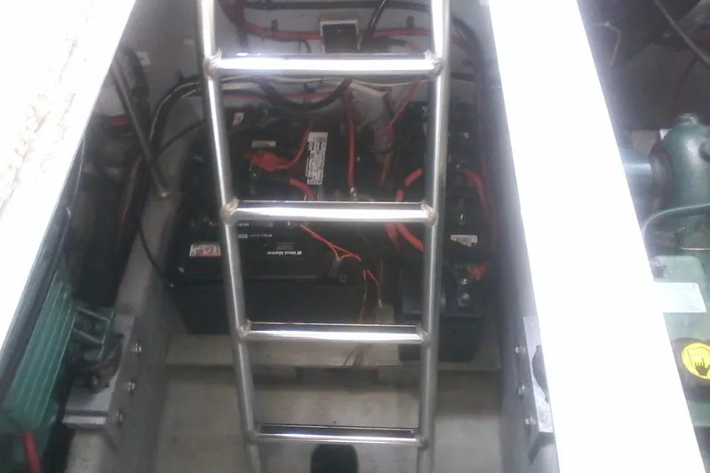 Lusea Yacht Photos Pics Engine compartment of 1997 Mainship 350 with batteries and wiring visible.