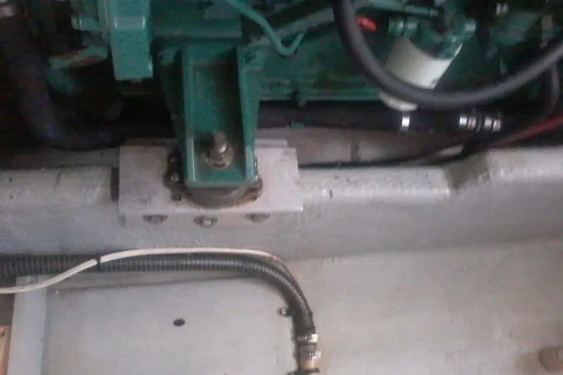 Lusea Yacht Photos Pics Engine compartment of a 1997 Mainship 350 boat, showing mechanical components and hoses.