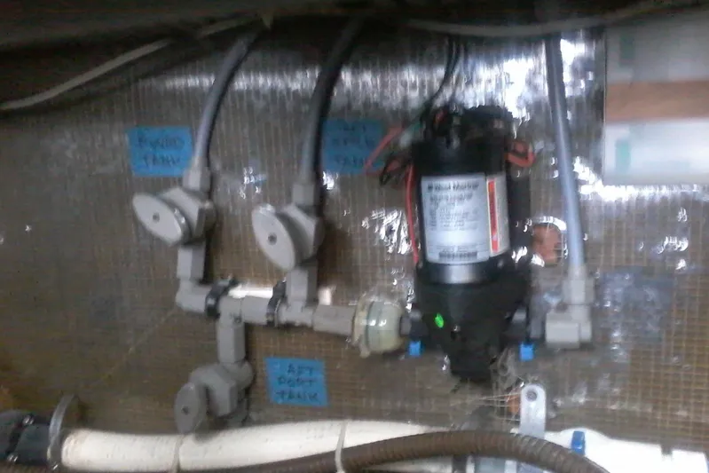 Lusea Yacht Photos Pics 1997 Mainship 350 boat plumbing system with labeled water tanks and pump.