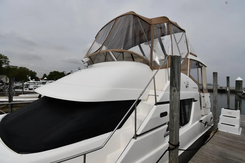 Lady Louise Yacht Photos Pics 2000 Silverton 392 Motor Yacht docked at marina under cloudy sky.