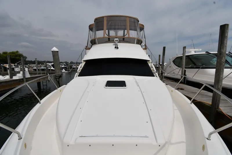 Lady Louise Yacht Photos Pics 2000 Silverton 392 Motor Yacht docked at marina, showcasing sleek design and spacious deck.