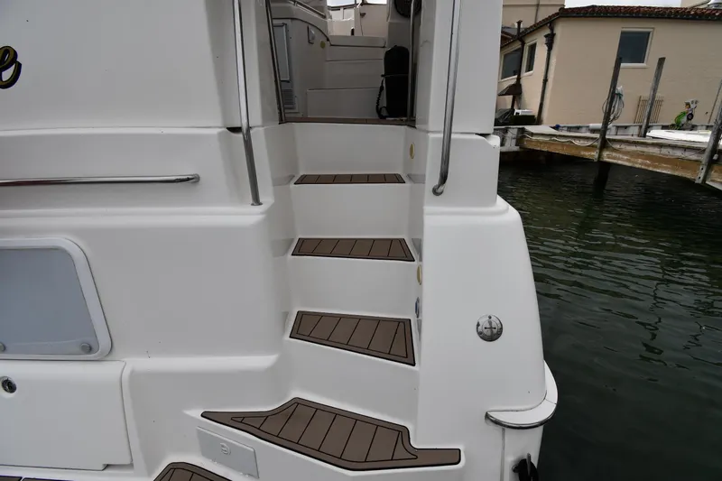 Lady Louise Yacht Photos Pics Staircase on a 2000 Silverton 392 Motor Yacht by the water.