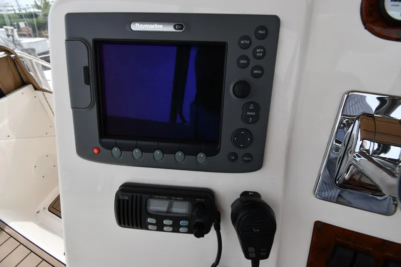 Lady Louise Yacht Photos Pics Control panel of a 2000 Silverton 392 Motor Yacht with navigation and communication equipment.