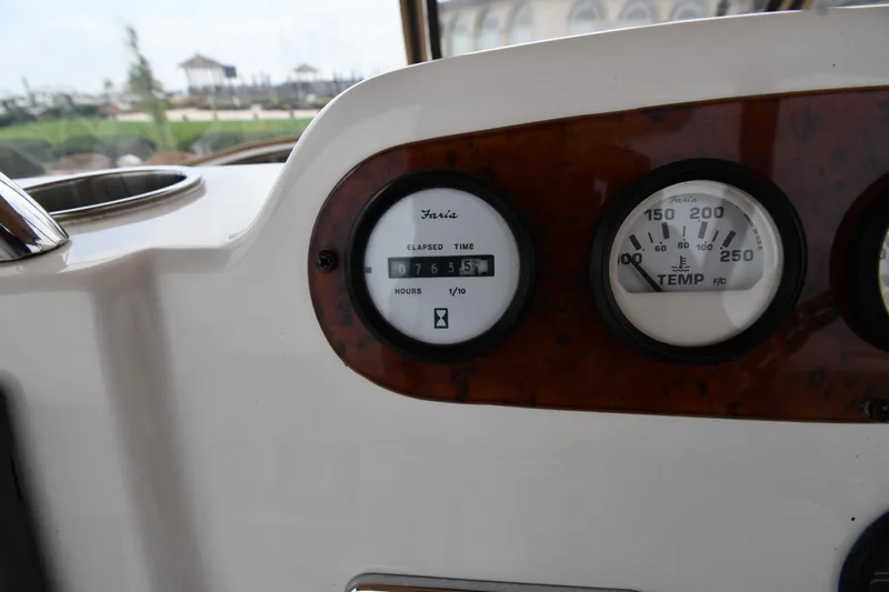 Lady Louise Yacht Photos Pics Close-up of 2000 Silverton 392 Motor Yacht dashboard gauges, showing hours and temperature.
