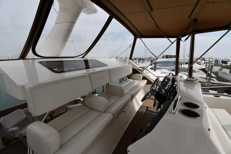 Lady Louise Yacht Photos Pics Interior view of 2000 Silverton 392 Motor Yacht with luxurious seating and helm.