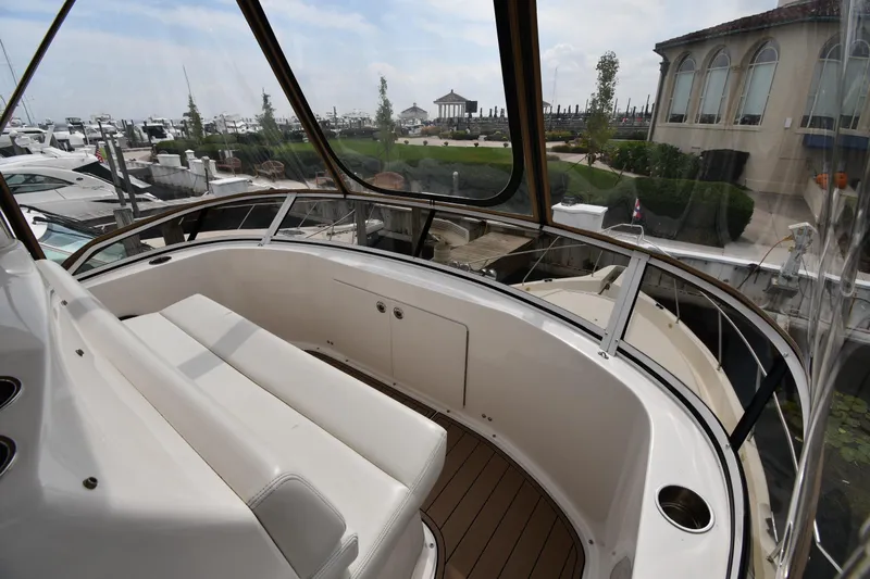 Lady Louise Yacht Photos Pics 2000 Silverton 392 Motor Yacht with spacious seating area and marina view.