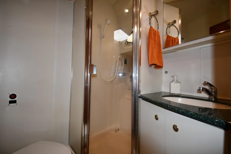 Lady Louise Yacht Photos Pics Bathroom interior of 2000 Silverton 392 Motor Yacht with shower and sink.