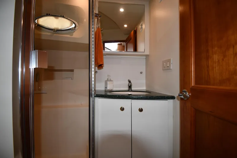 Lady Louise Yacht Photos Pics Bathroom interior of 2000 Silverton 392 Motor Yacht with shower and sink.