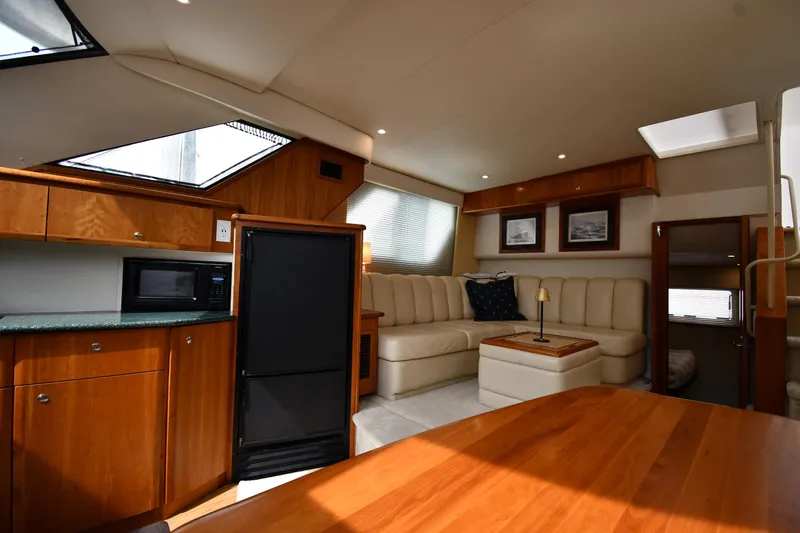 Lady Louise Yacht Photos Pics Luxurious interior of 2000 Silverton 392 Motor Yacht with plush seating and modern amenities.