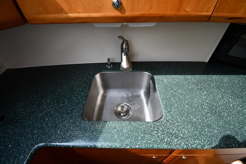Lady Louise Yacht Photos Pics Stainless steel sink in 2000 Silverton 392 Motor Yacht kitchen area.
