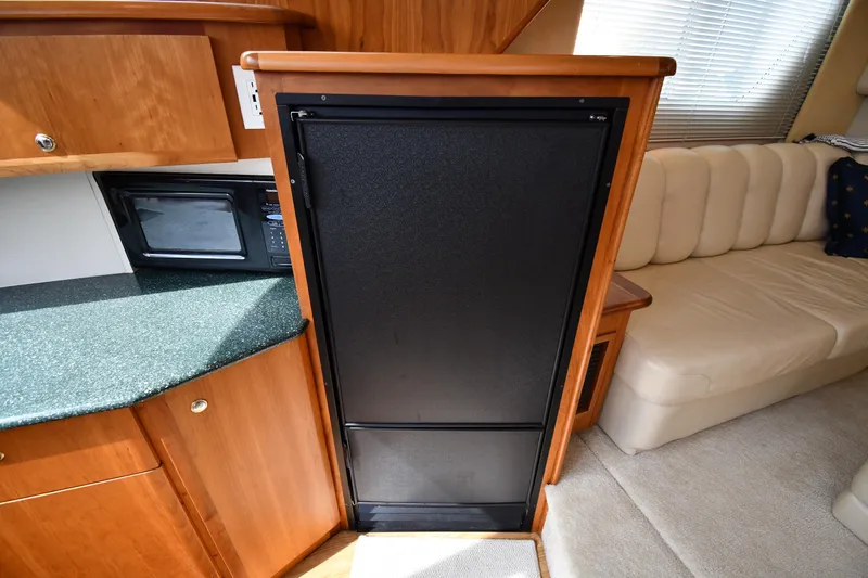 Lady Louise Yacht Photos Pics Interior of 2000 Silverton 392 Motor Yacht with kitchenette and seating area.