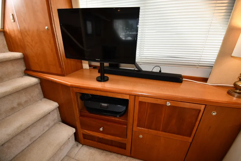 Lady Louise Yacht Photos Pics Interior of 2000 Silverton 392 Motor Yacht with TV and wooden cabinetry.