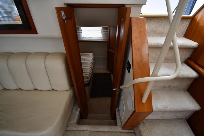 Lady Louise Yacht Photos Pics Interior of 2000 Silverton 392 Motor Yacht with stairs and cozy seating area.