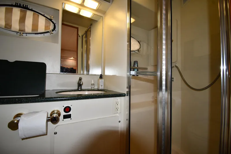 Lady Louise Yacht Photos Pics Bathroom interior of 2000 Silverton 392 Motor Yacht with shower and sink.