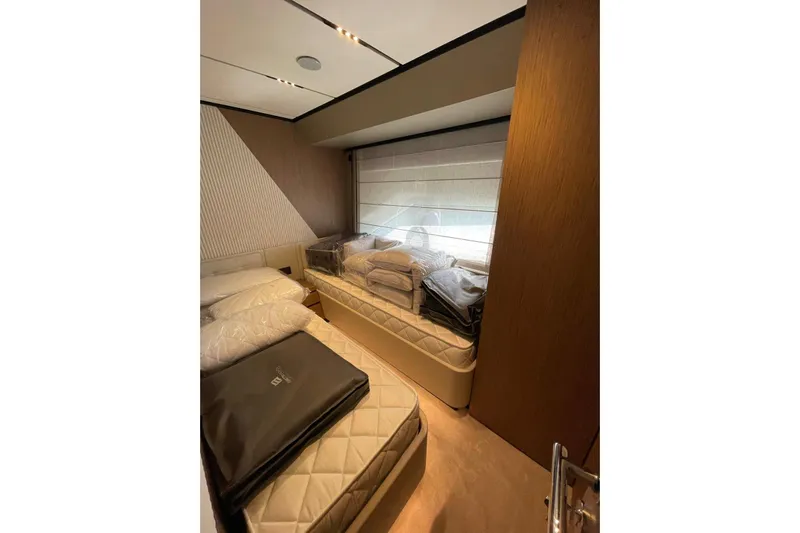  Yacht Photos Pics Luxurious cabin interior of 2021 Ferretti Yachts 720 with twin beds and modern decor.