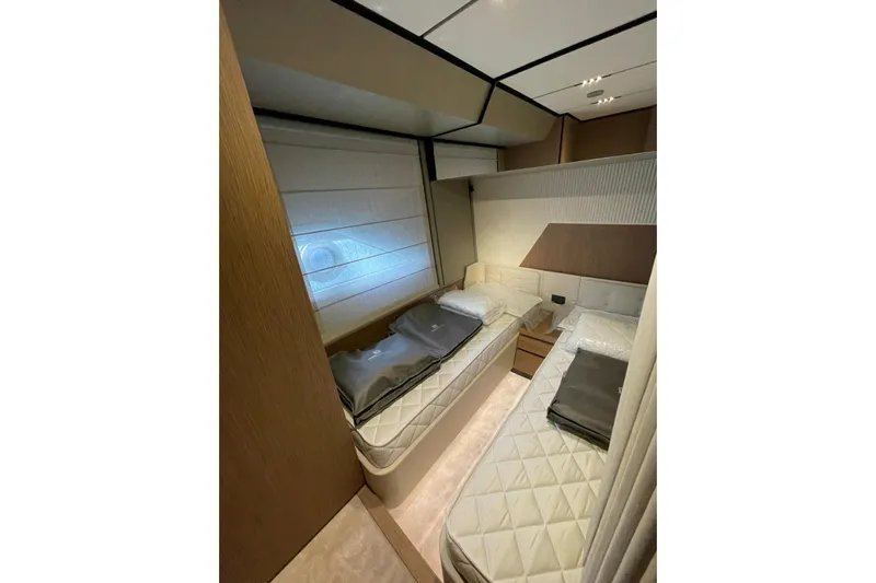  Yacht Photos Pics Luxurious twin cabin interior on 2021 Ferretti Yachts 720, featuring modern design and comfort.