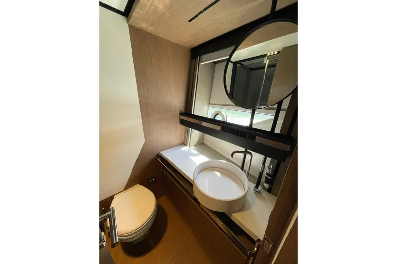  Yacht Photos Pics Luxurious bathroom in 2021 Ferretti Yachts 720, featuring modern fixtures and elegant design.