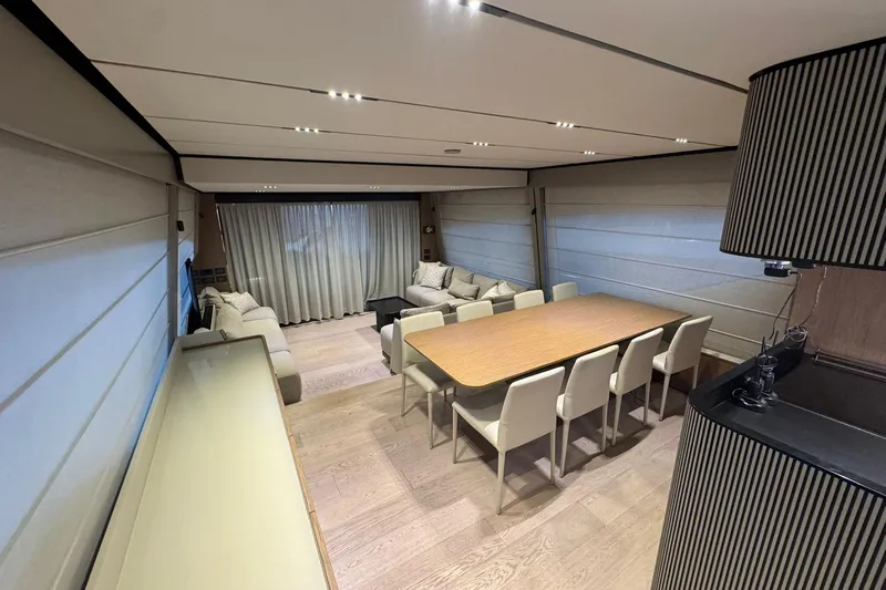  Yacht Photos Pics Luxurious interior of 2021 Ferretti Yachts 720 with elegant dining area and modern furnishings.