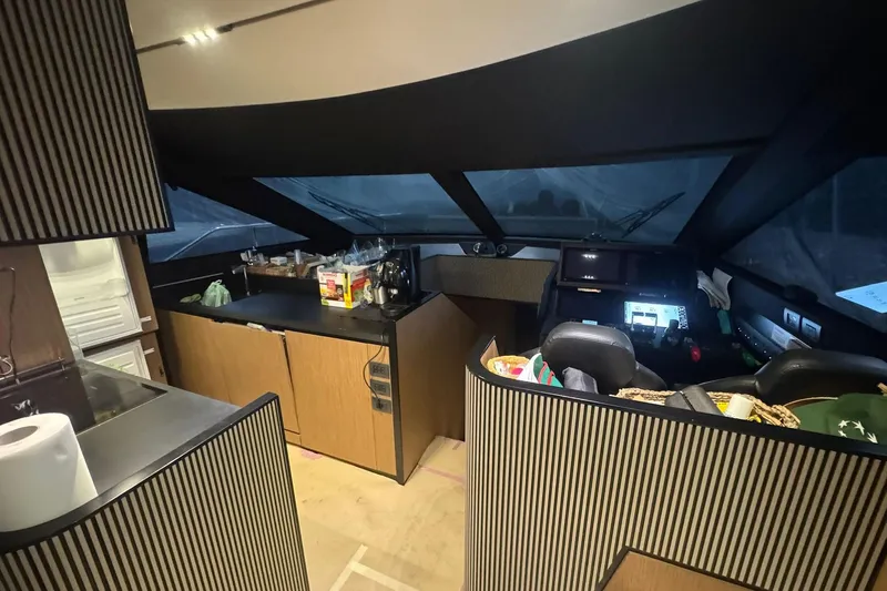  Yacht Photos Pics Interior of 2021 Ferretti Yachts 720, featuring modern kitchen and helm station.