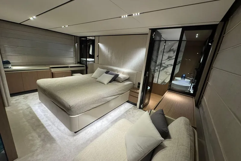  Yacht Photos Pics Luxurious bedroom interior of 2021 Ferretti Yachts 720 with modern design and ensuite bathroom.