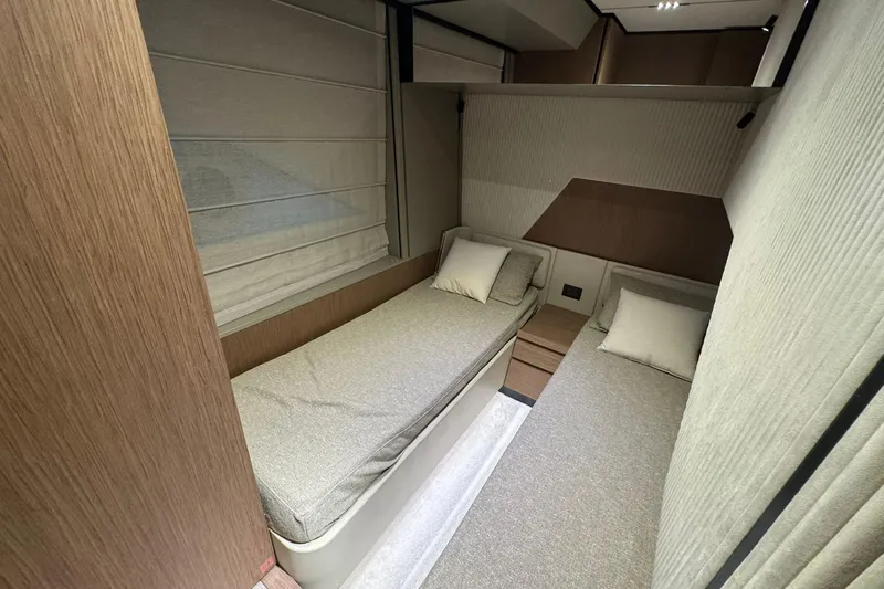  Yacht Photos Pics Interior of 2021 Ferretti Yachts 720, featuring twin beds in a modern cabin.