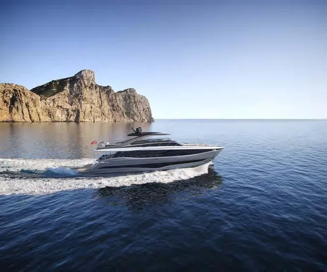  Yacht Photos Pics 2025 Princess Y95 Motor Yacht cruising near rocky coastline.