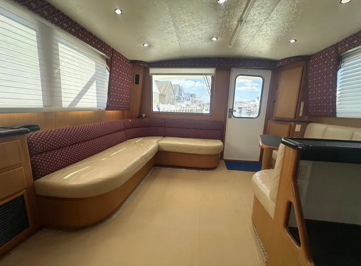 Current Addition Yacht Photos Pics Interior of 2006 Henriques 42 Convertible yacht with spacious seating and elegant design.