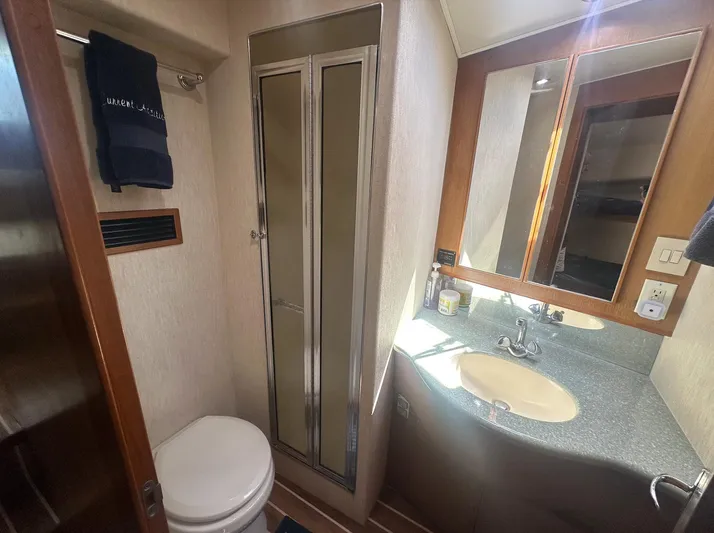 Current Addition Yacht Photos Pics Bathroom interior of 2006 Henriques 42 Convertible yacht with shower and sink.